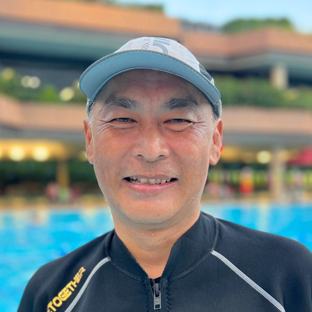 Coach Elvin teaching swimming at Singapore Swimming Academy pool