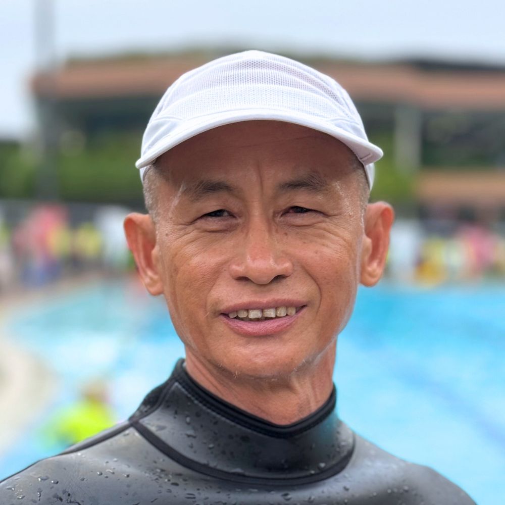 Coach Ken conducting a swim lesson at Singapore Swimming Academy